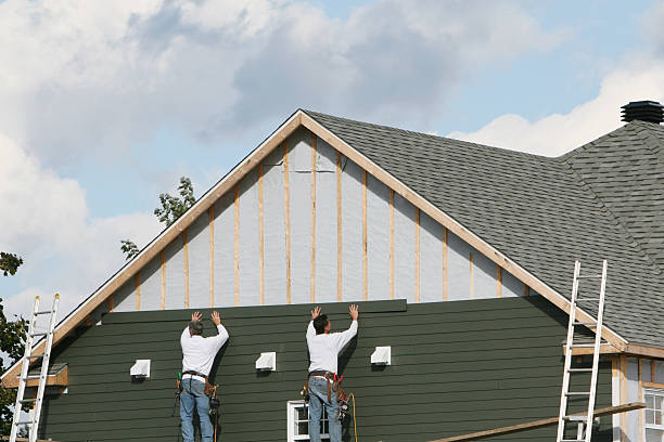Professional Storm Damage Siding Repair technician working in Colchester, CT